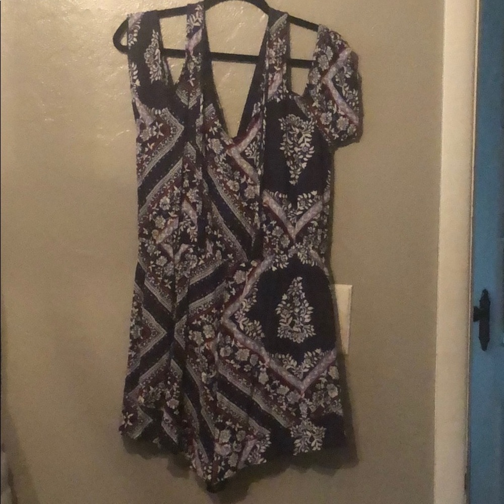 Floral navy blue, white, and hints of red blouse